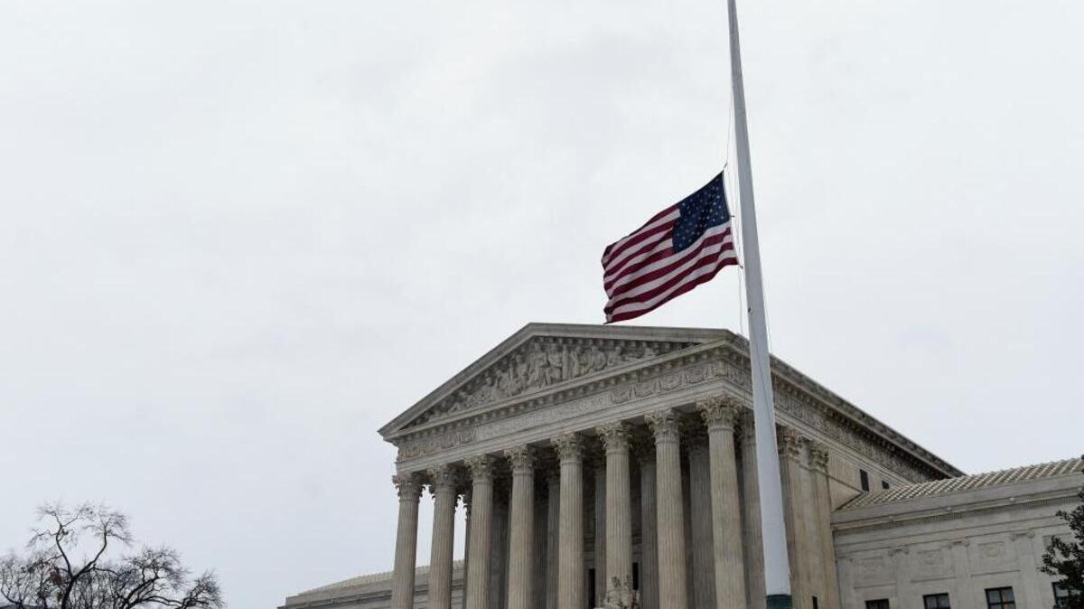 The flag flies at half-staff outside the Supreme Court in Washington, Tuesday, Feb. 16, 2016, following the death of Supreme Court Justice Antonin Scalia over the weekend.