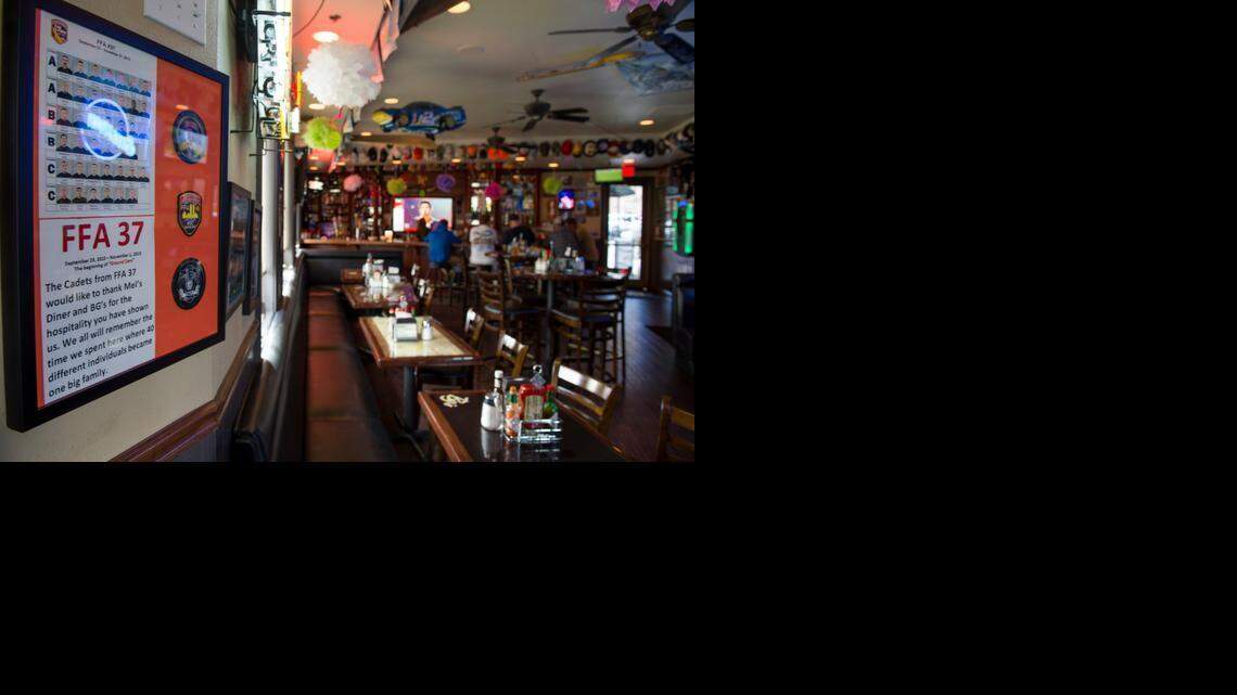 
A Cal Fire poster hangs in Bg’s bar next to Mel and Faye’s Diner on Wednesday in Jackson. The tavern was once a regular hangout for Cal Fire Academy’s instructors and cadets, before scandal erupted around the department following the arrest of former Ione academy instructor Orville “Moe” Fleming in the murder of his girlfriend, Sarah June Douglas, 26.
