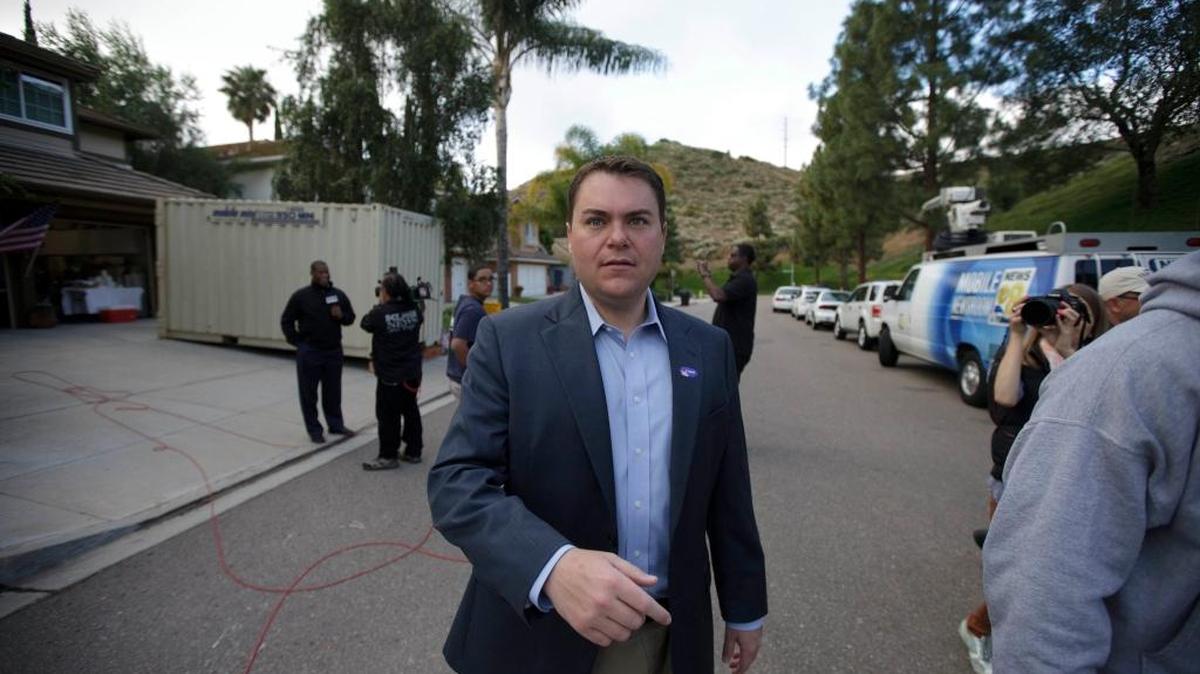 
Then-San Diego mayoral candidate and city councilman Carl DeMaio walks out of a polling place in 2012.

