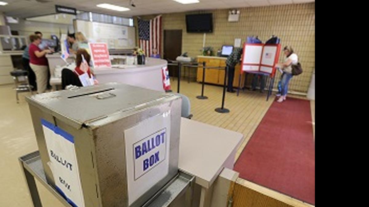 
Voters cast their ballots inside the County Registrar's office in downtown Modesto. A new 2016 ballot proposal would add government employee pay and benefits to the list of issues that would go before California voters.
