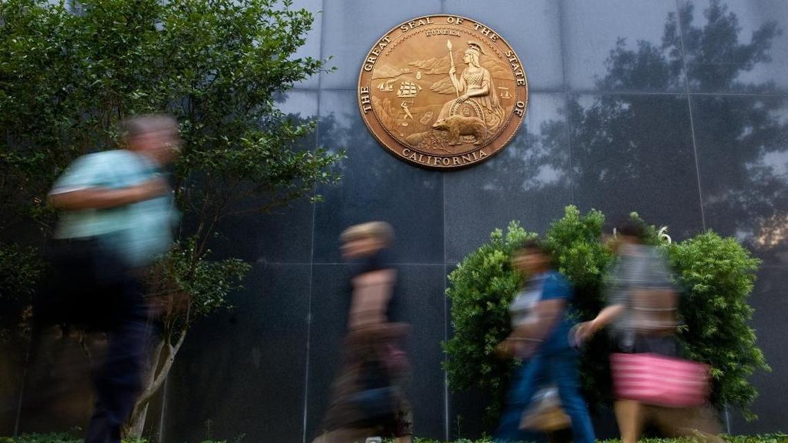 State workers exiting the State of California Resources Building offices in Sacramento on July 23, 2008.