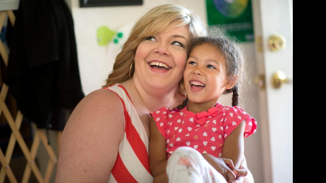 
Amber MacDonald plays with her daughter Halo after dropping her off at Tisa Kelley’s child care service in the La Riviera area of Sacramento on Thursday. “She’s open 24-7 for me,” MacDonald said. “She’s able to care for my kids so that I can provide for them.”
