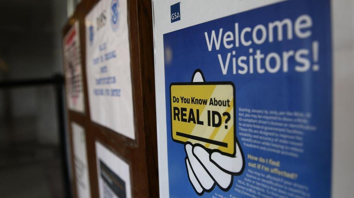 A sign at the federal courthouse in Tacoma, Wash., informs visitors of the federal government's Real ID act, which requires state driver's licenses and ID cards to have security enhancements and be issued to people who can prove they're legally in the United States. California began offering Real ID cards as an option Monday through the Department of Motor Vehicles.
