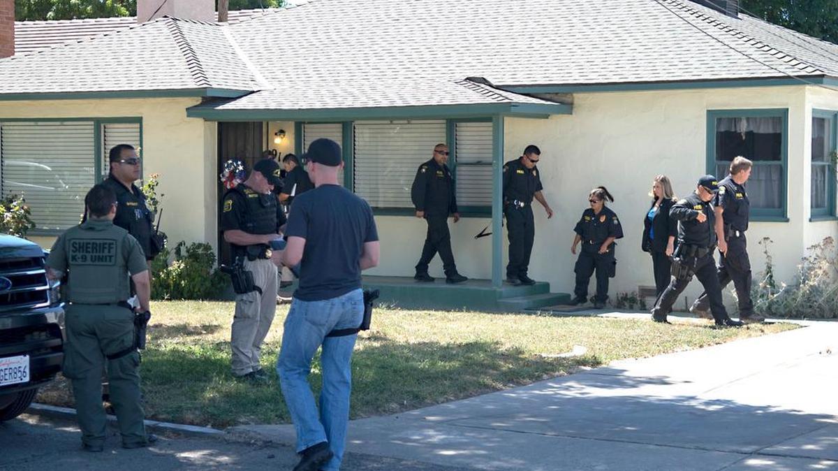 
Officers are on scene at the home of defense attorney Frank Carson on 9th Street in Turlock, Calif. on Friday (08-14-15).
