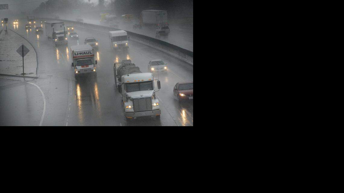 
Traffic travels north on Highway 99 in the rain Dec. 11, 2014. The major storm in December involved an atmospheric river – a phenomenon that top scientists are studying in Sacramento this week.
