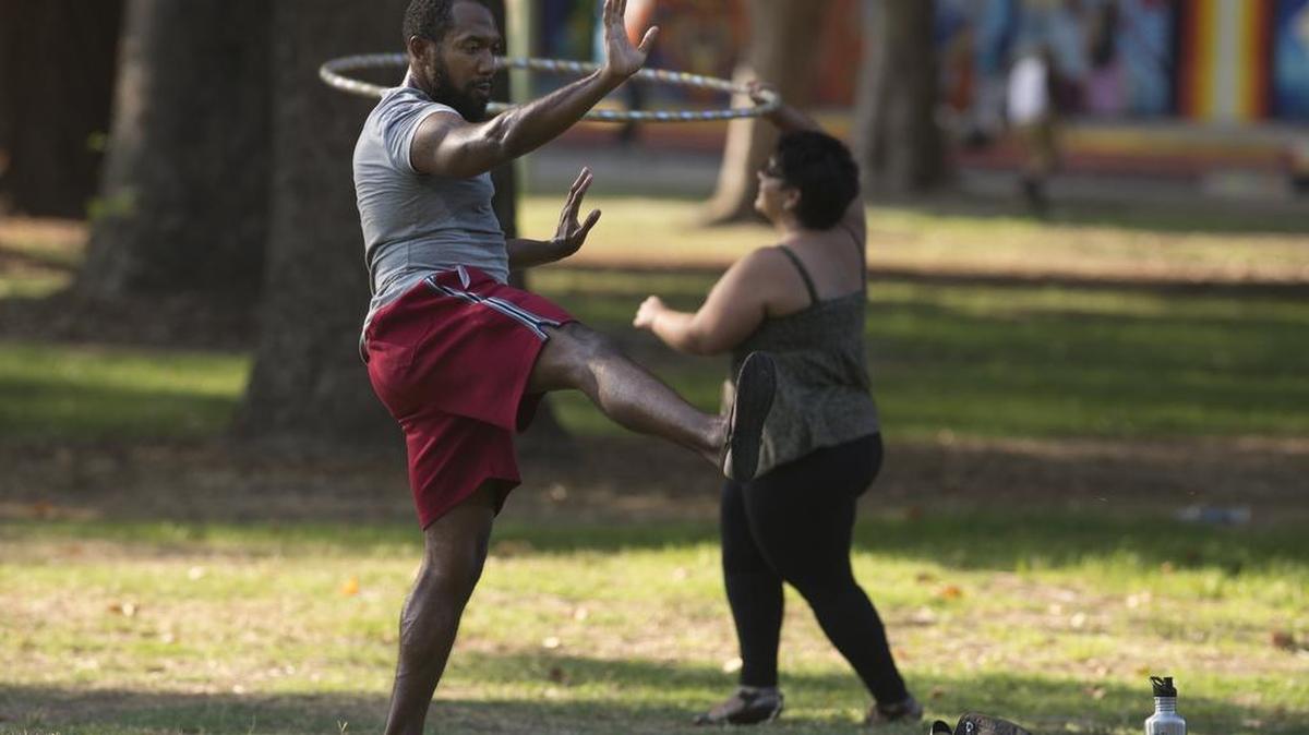 
Richard Hicks practices "Chen" style Tai Che and Christine Rivera practices hulu hoop dancing at Southside Park as temperatures topped 104 on Monday, August 17, 2015 in Sacramento, Calif. 
