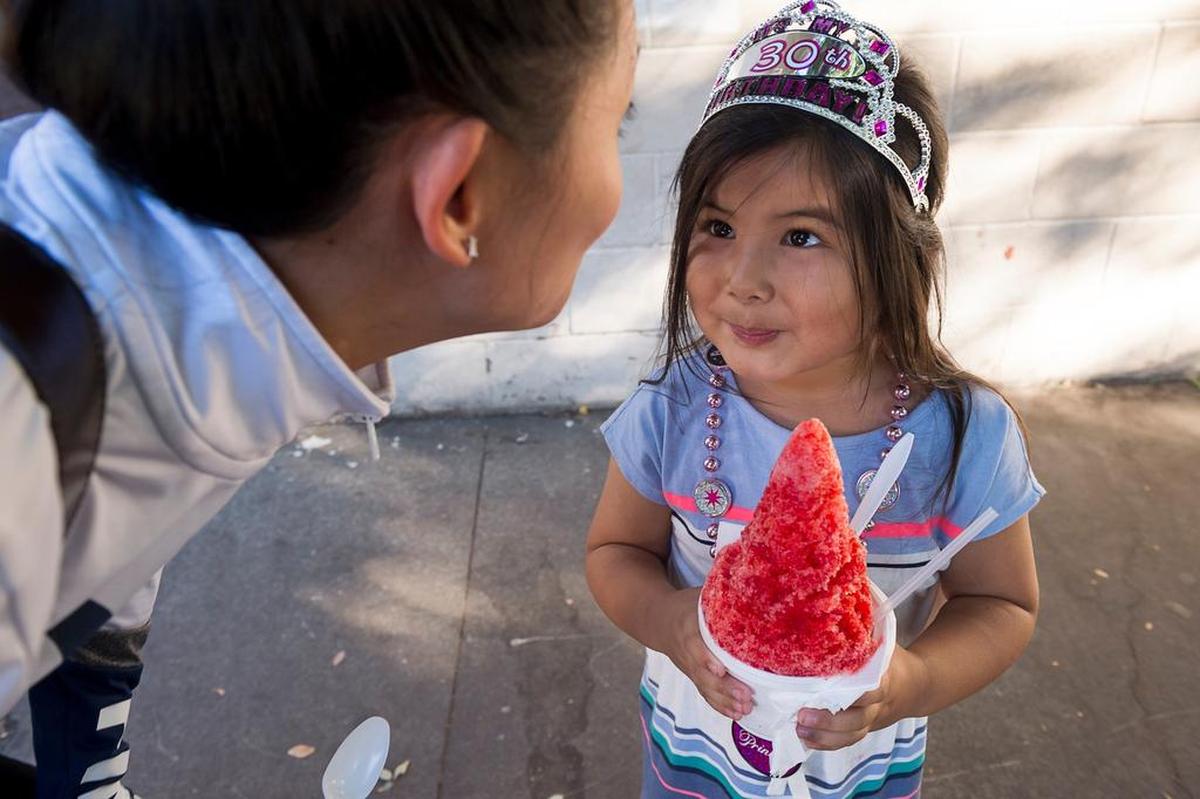 Laila Lam, 4, enjoys shaved ice with her godmother, Cheyser Ebanez, at Osaka-Ya in Sacramento in 2017.