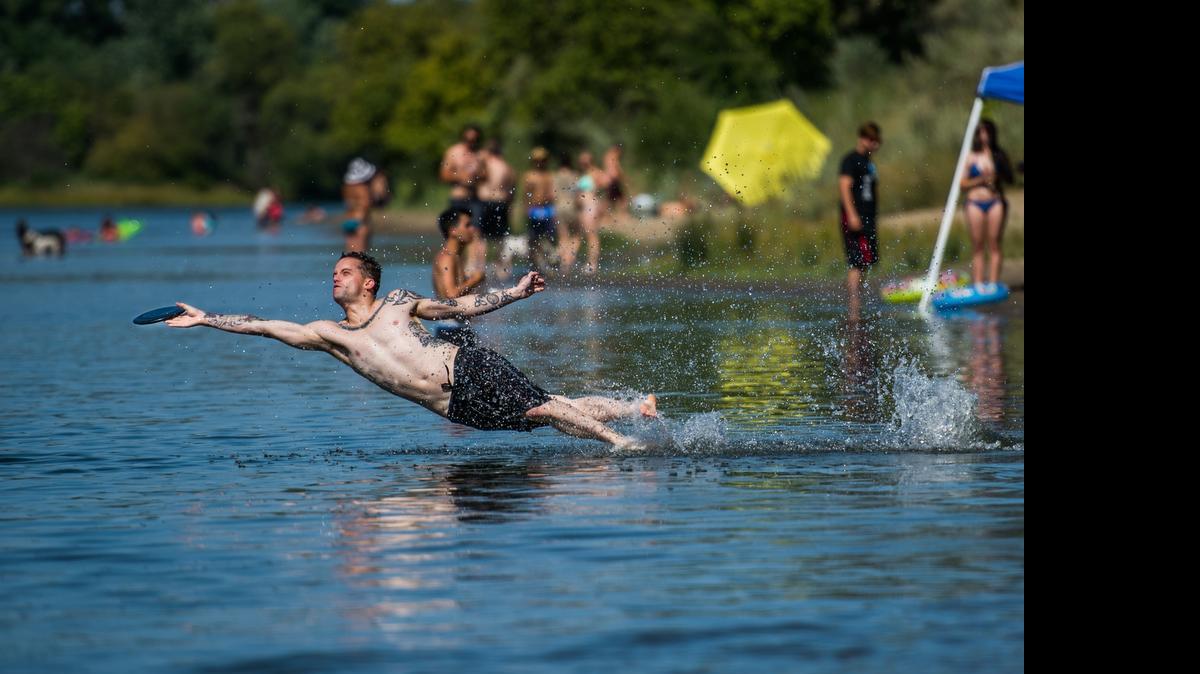 
Mike Maestretti of Sacramento celebrates his 27th birthday playing Frisbee at Sutter's Landing Park Wednesday.
