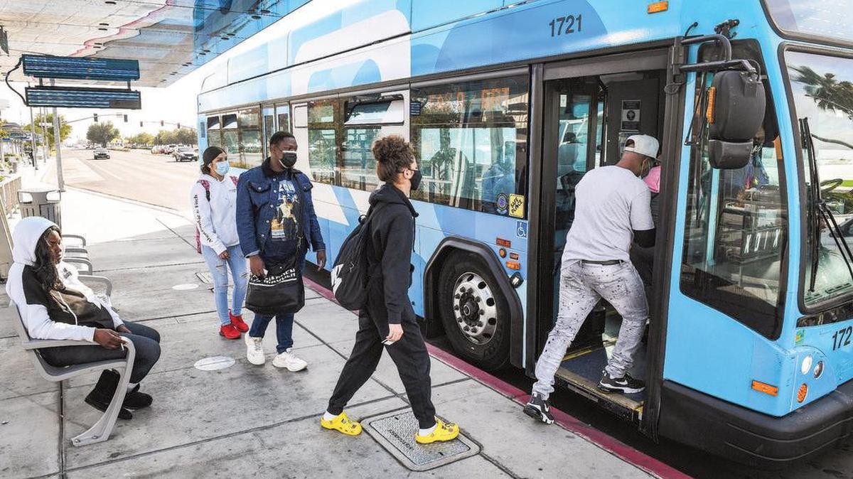 Passengers board a FAX bus at a stop near Manchester Center in Fresno. In Fresno County, about 65% of all jobs are within a 10-minute walk to a bus stop, according to census data retrieved for Fresnoland by the Fresno Council of Governments. But commute times for bus riders in Fresno are nearly double what car owners deal with.