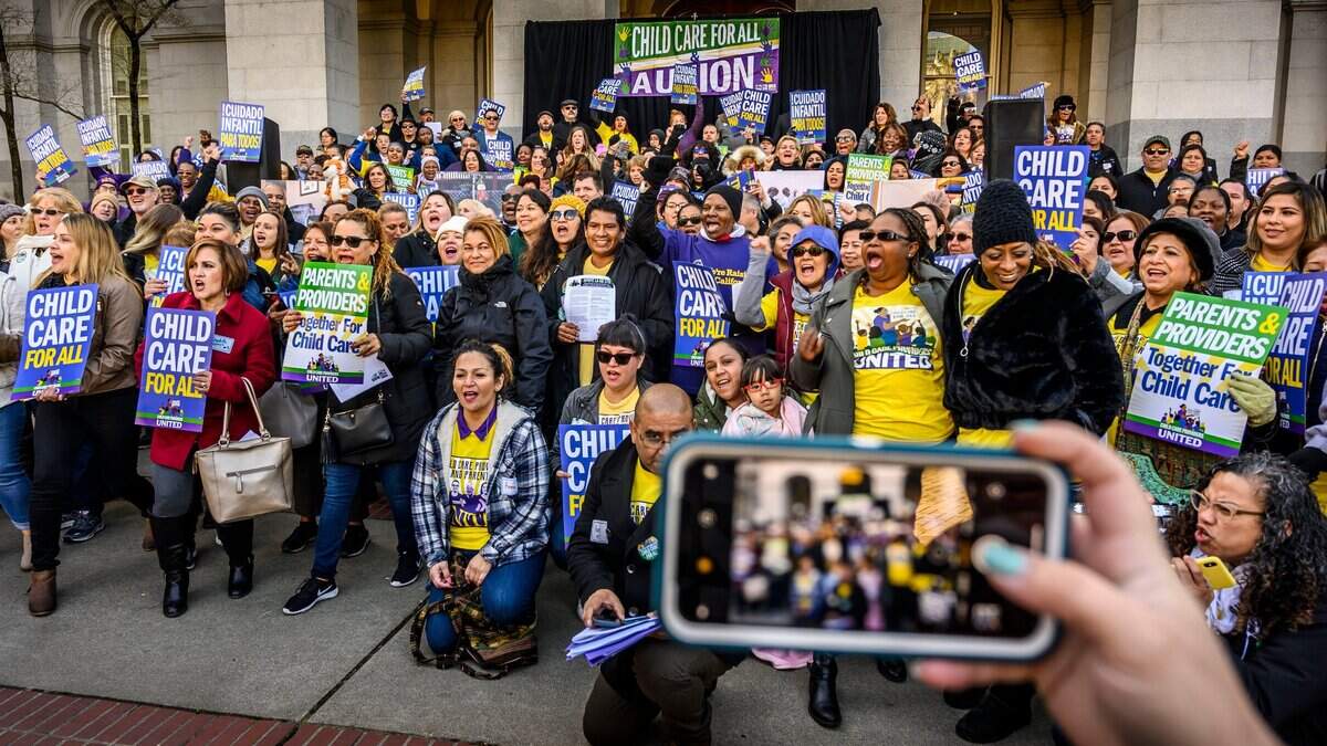 A group of child care providers, parents and advocates rally on the North steps of the Capitol on Wednesday, Feb. 6, 2019 to support Bill AB 378, which will push for better early child care and the opportunity for child care providers to form unions.