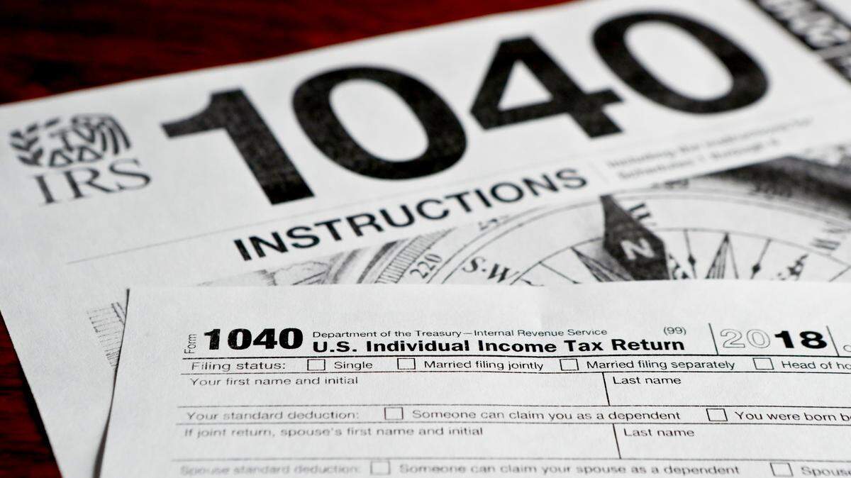 This photo made on Wednesday, Feb. 13, 2019, in Zelienople, Pa., shows mulitiple forms printed from the Internal Revenue Service web page that are used for 2018 U.S. federal tax returns. (AP Photo/Keith Srakocic)