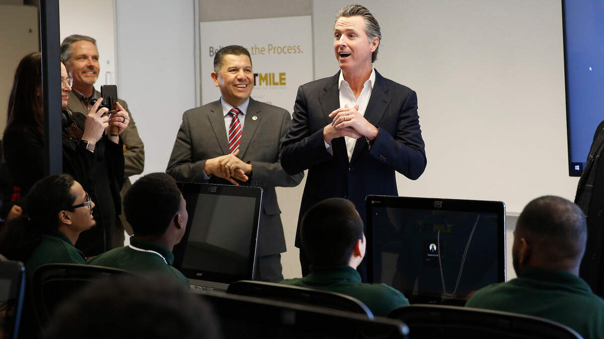 Gov. Gavin Newsom, right, addresses youthful offenders taking a computer coding class at the O.H. Close Youth Correctional Facility, Tuesday, Jan. 22, 2019, in Stockton, Calif. Newsom is proposing to put California’s juvenile prisons under the state’s Health and Human Services Agency instead of the same agency that runs adult prisons. (AP Photo/Rich Pedroncelli)