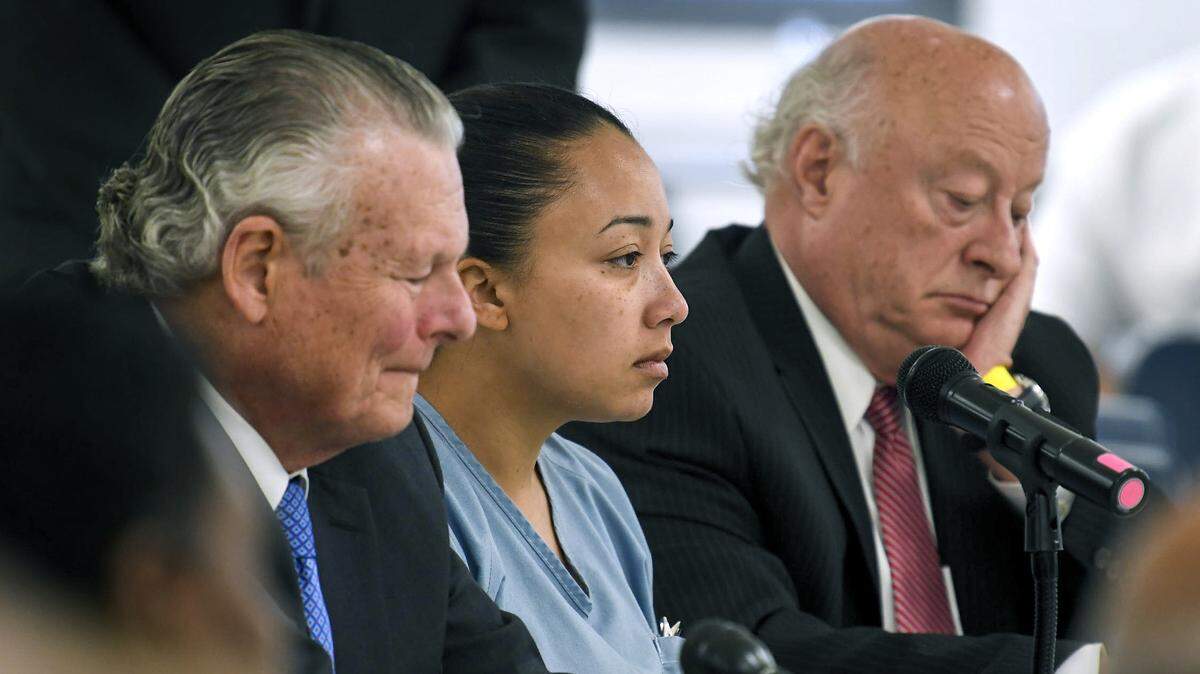 Cyntoia Brown sits between her council Charles Bone, left and Houston Gordon, right, as they listen to the parole board’s split decision in her clemency hearing at the Tennessee Prison for Women in Nashville, Tenn., Wednesday, May 23, 2018. (Lacy Atkins/The Tennessean via AP, Pool)
