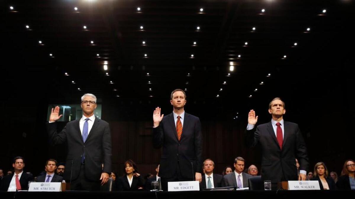 Facebook's General Counsel Colin Stretch, Twitter's Acting General Counsel Sean Edgett, and Google's Senior Vice President and General Counsel Kent Walker, are sworn in for a Senate Intelligence Committee hearing on Russian election activity and technology, on Capitol Hill in Washington, Nov. 1, 2017.