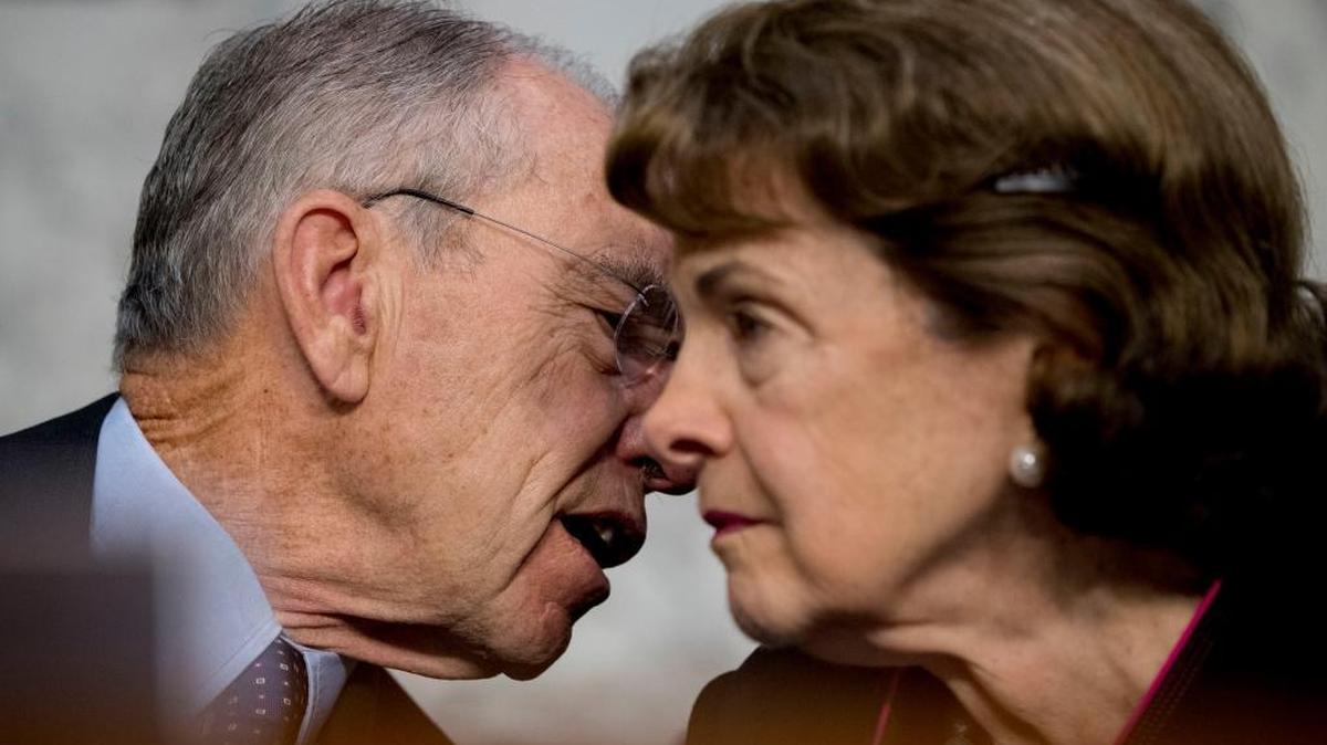 Iowa Republican Sen. Chuck Grassley, and California Democratic Sen. Dianne Feinstein, right, confer during a Senate Judiciary Committee hearing on the Trump Administration's decision to end Deferred Action for Childhood Arrivals otherwise known as DACA. (AP Photo/Andrew Harnik)