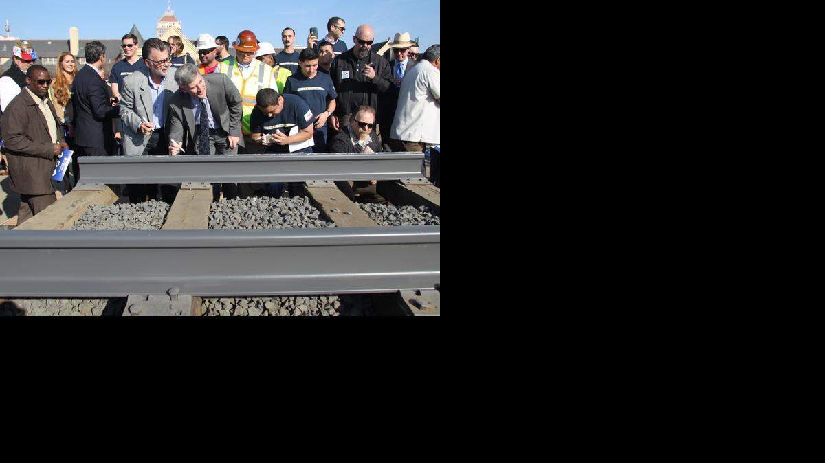 
People line up to sign a portion of the rail at the California High-Speed Rail Authority groundbreaking event held Jan. 6 in Fresno.
