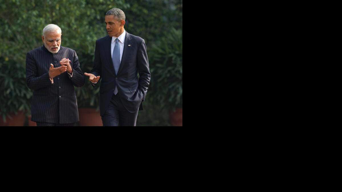 
President Barack Obama talks with Indian Prime Minister Narendra Modi in the gardens of the Hyderabad House in New Delhi, India, last Sunday. Seizing on their personal bond, Obama and Modi voiced optimism that they could find common ground on defense, commerce and environmental issues. 
