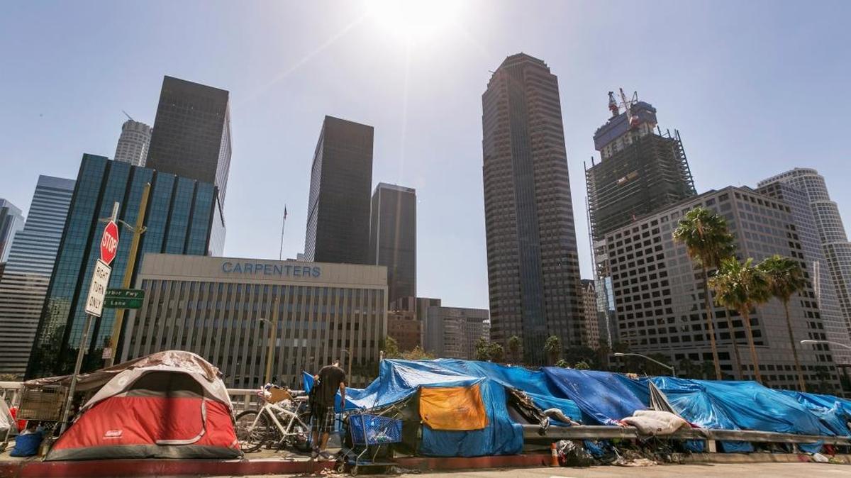 In this September 2015 photo, tents used by the homeless line a downtown Los Angeles street. California is a global economic engine but also is the nation’s most poverty-stricken state.