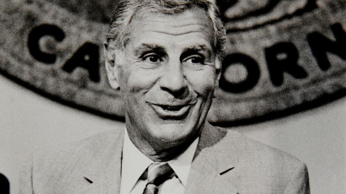 Gov. George Deukmejian talks with reporters at his office in the Capitol in 1987 in Sacramento. The two-term California governor, whose anti-spending credo earned him the nickname “The Iron Duke,” died Tuesday, May 8, 2018, of natural causes, a former chief of staff said. He was 89. (AP Photo/Walt Zeboski, File)