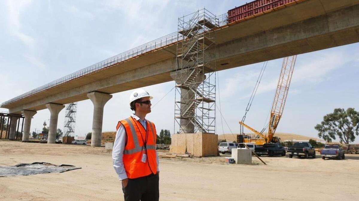 California High-Speed Rail Authority transportation engineer Robert Campbell stands near the Cedar Viaduct under construction near Highway 99 in Fresno on Monday, July 10, 2017. A $20 billion segment between Fresno and San Jose is scheduled to open by 2025. (Gary Reyes/Bay Area News Group/TNS)