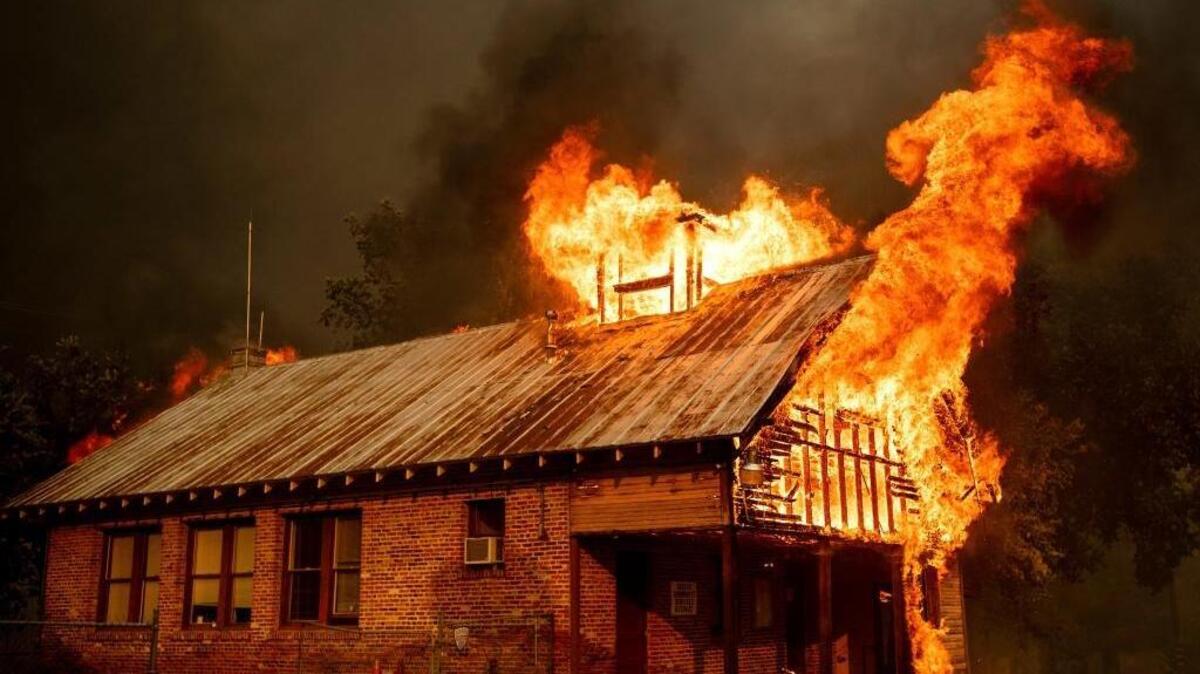 An historic schoolhouse burns as the Carr Fire tears through Shasta, Calif., Thursday, July 26, 2018. (AP Photo/Noah Berger)