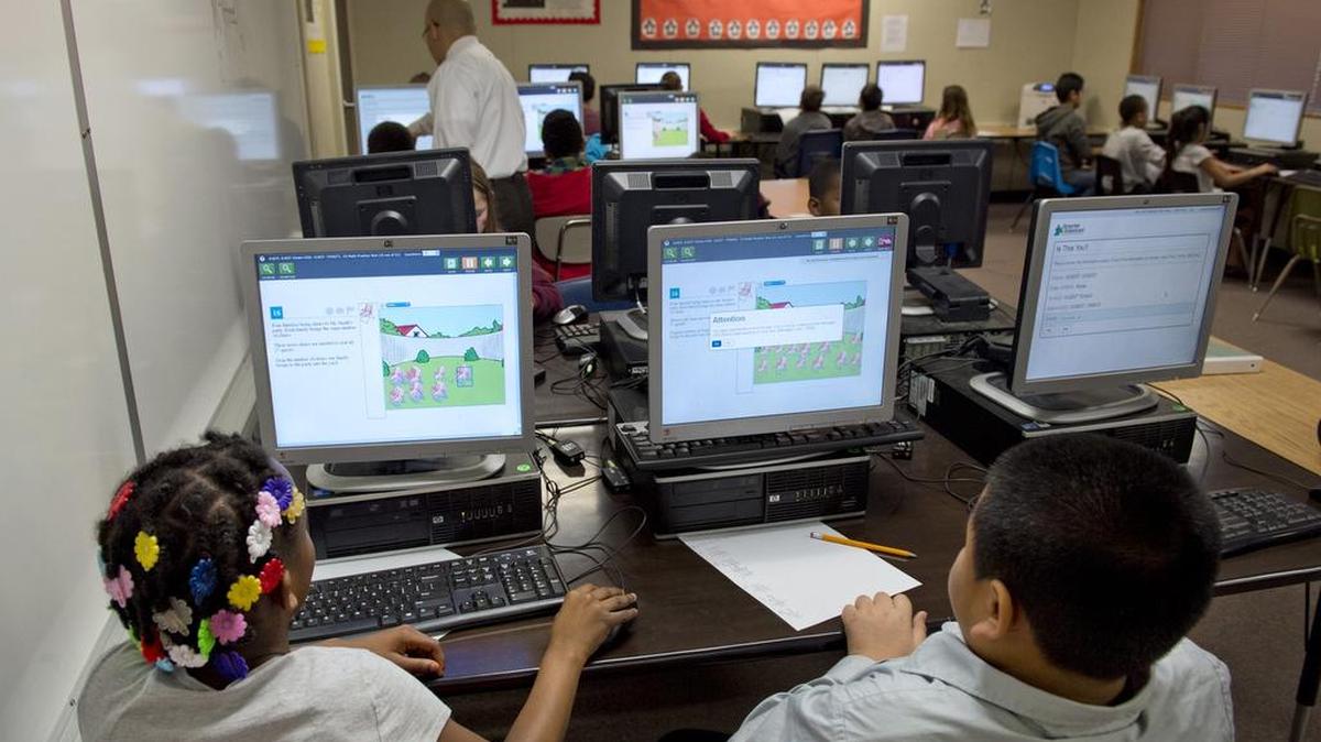 Fourth-grade students in the Twin Rivers School District take a practice exam in 2014, before the rollout of Common Core curriculum and testing. After four years of using the tests, questions remain about how well they measure learning and academic readiness.