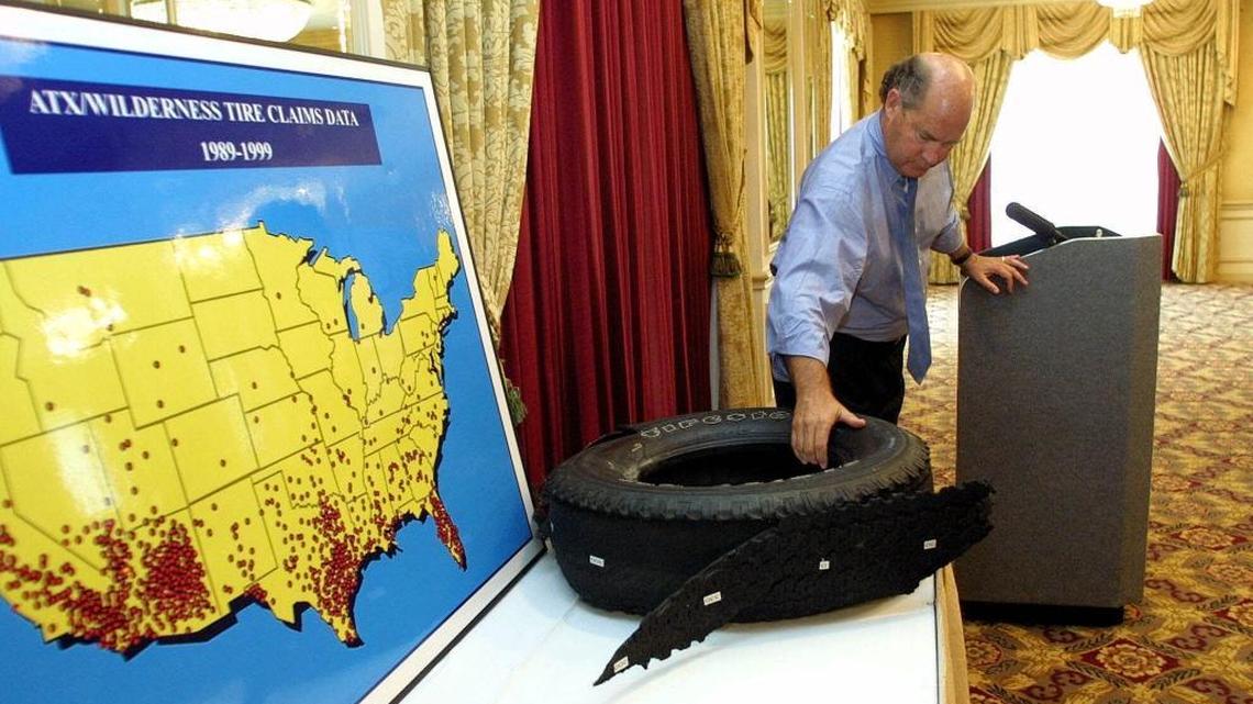 Attorney Bob Patterson moves a shredded Firestone AT tire used as evidence in a 2001 lawsuit against Bridgestone/Firestone Inc. More than 150 people died because of a defect in their construction before they were recalled in 2000, but the public was unaware due to confidentiality clauses in court settlements.