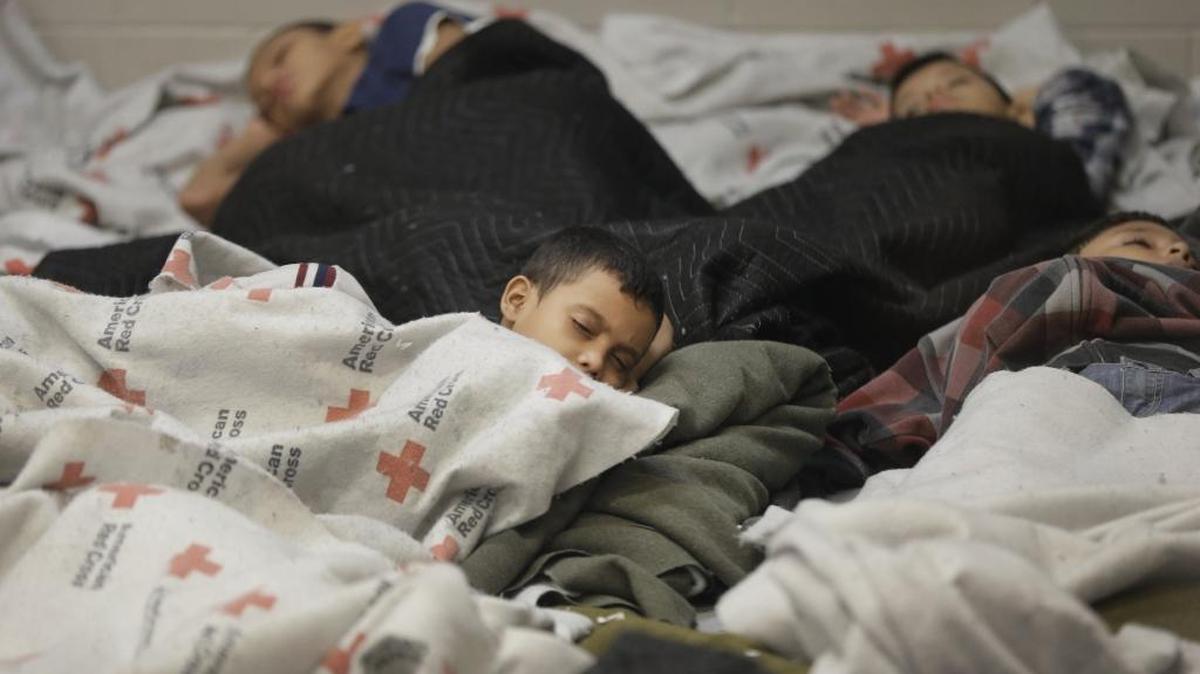Child detainees sleep in a holding cell at a U.S. Customs and Border Protection processing facility in Brownsville, Texas, June 18, 2014. (AP Photo/Eric Gay, Pool, File)