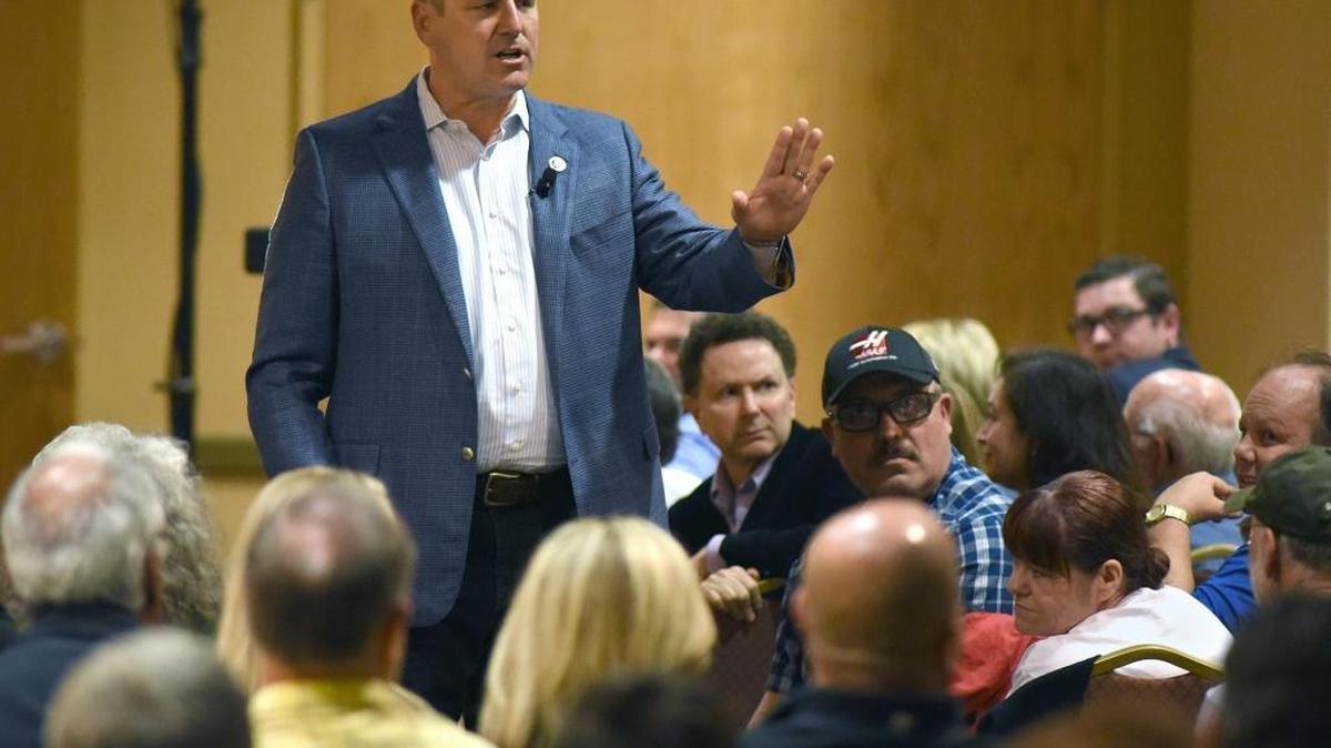 Rep. Jeff Denham, R-Turlock, addresses a crowded town hall meeting in Turlock in April. Denham’s House seat is through to be vulnerable.