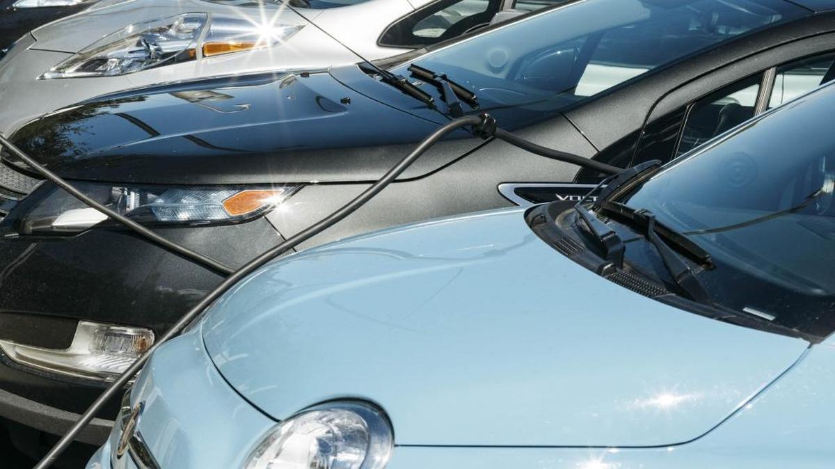 Electric vehicles charging at Intuit in Mountain View. (Jason Henry/The New York Times)