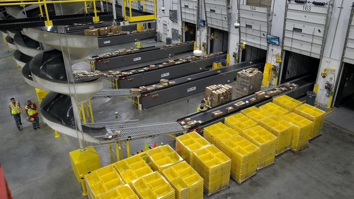 Packages are sorted and routed for delivery at the Amazon Fulfillment Center in Sacramento on Friday, February 9, 2018.