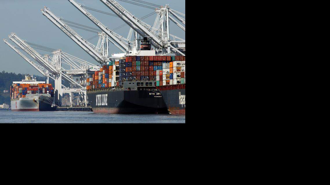 
Container ships wait at the dock to be unloaded at the Port of Oakland on Thursday. Companies that operate marine terminals didn’t call workers to unload ships Thursday that carry car parts, furniture, clothing, electronics, just about anything made in Asia and destined for U.S. consumers. The partial lockout is the result of an increasingly damaging labor dispute between dockworkers and their employers. The two sides have been negotiating a new contract, and stalled talks have all but paralyzed 29 ports that handle about one-quarter of U.S. international trade, about $1 trillion worth of cargo annually. 
