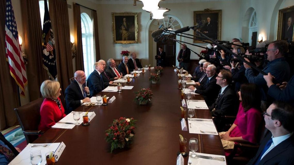 President Donald Trump, third from left, meets with lawmakers working on the tax cuts in the Cabinet Meeting Room of the White House in Washington, Wednesday, Dec. 13, 2017. Attending the meeting are from left, Rep. Diane Black, R-Tenn.; Rep. Kevin Brady, R-Texas; Trump; Sen. Orrin Hatch, R-Utah; Rep. John Shimkus, R-Ill.; Rep. Fred Upton, R-Mich.; Treasury Secretary Steven Mnuchin, from right to left; Rep. Kristi Noem, R-S.D.; Rep. Peter Roskam, R-Ill.; Vice President Mike Pence; Sen. Mike Enzi, R-Wyo., and Rep. Rob Bishop R-Utah. (AP Photo/Manuel Balce Ceneta)