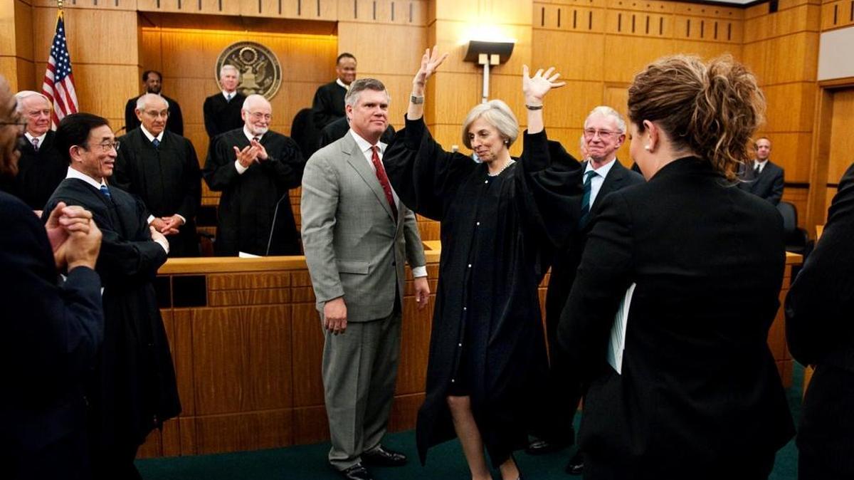 Judge Kimberly J. Mueller is sworn in as the first female federal judge in the Eastern District Court during a investiture ceremony at the courthouse in March 2011.