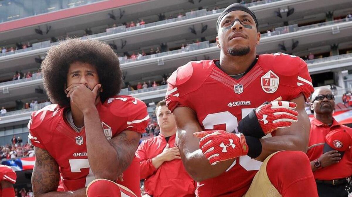 San Francisco 49ers quarterback Colin Kaepernick, left, and safety Eric Reid kneel in 2016 during the national anthem before an NFL football game against the Dallas Cowboys at Levi’s Stadium in Santa Clara.
