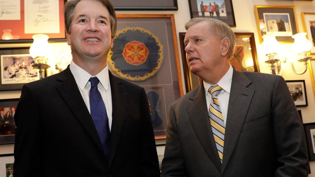 Sen. Lindsey Graham, R-S.C. (right) with Brett Kavanaugh, U.S. Supreme Court associate justice nominee, during a meeting on Capitol Hill in Washington on July 11, 2018. MUST CREDIT: Bloomberg photo by Yuri Gripas.