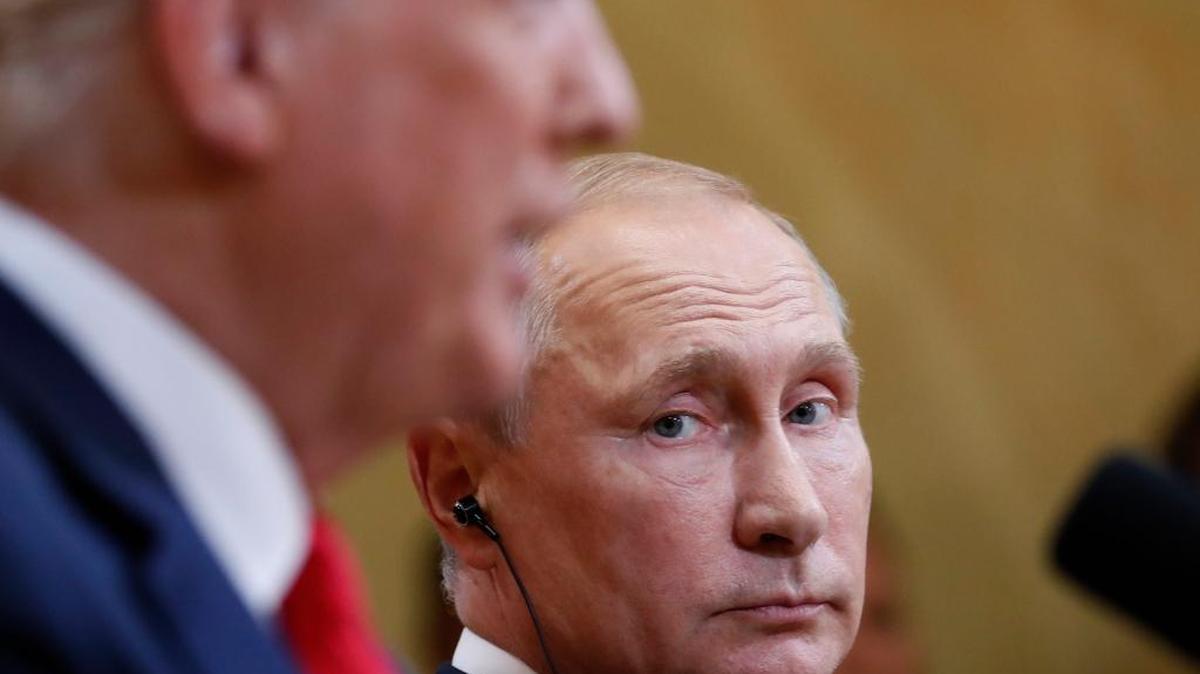 Russian President Vladimir Putin listens to U.S. President Donald Trump during a press conference after the meeting of U.S. President Donald Trump and Russian President Vladimir Putin at the Presidential Palace in Helsinki, Finland, Monday, July 16, 2018. (AP Photo/Pablo Martinez Monsivais)