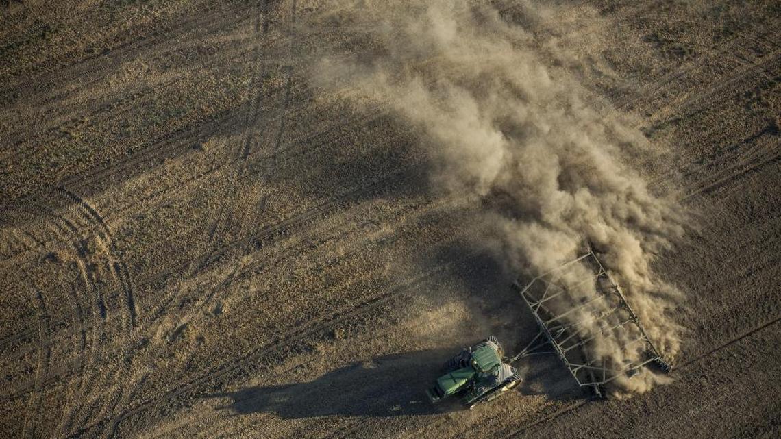 A tractor plows a field in the Westlands Water District in the Central Valley.