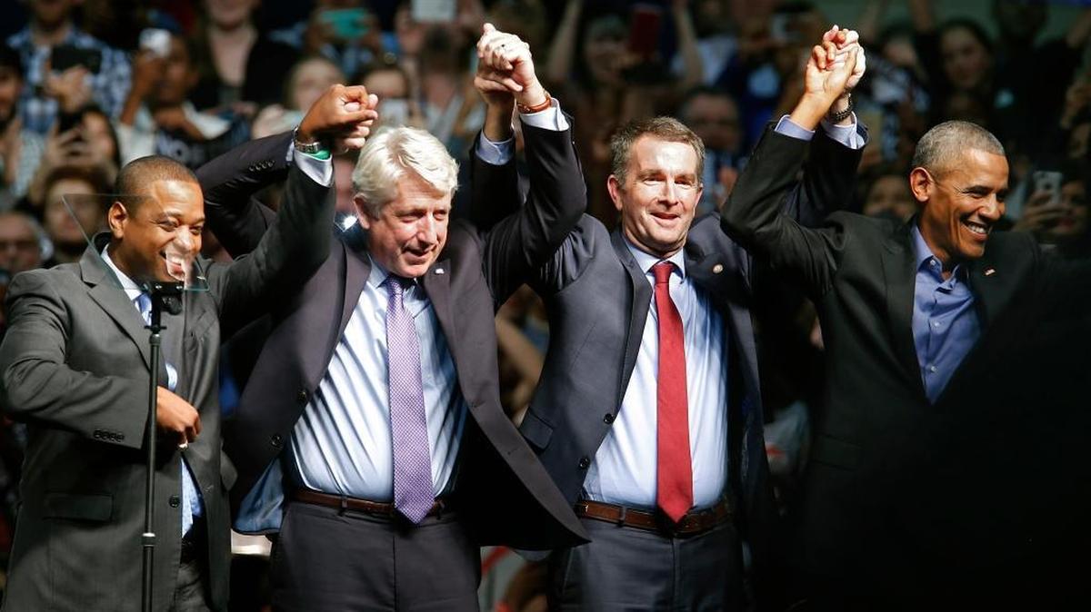 Former President Barack Obama joins hands with Virginia’s Democratic candidates, Justin Fairfax, Attorney General Mark Herring and Ralph Northam, in Richmond two weeks before Tuesday’s election, which was swept by Democrats.