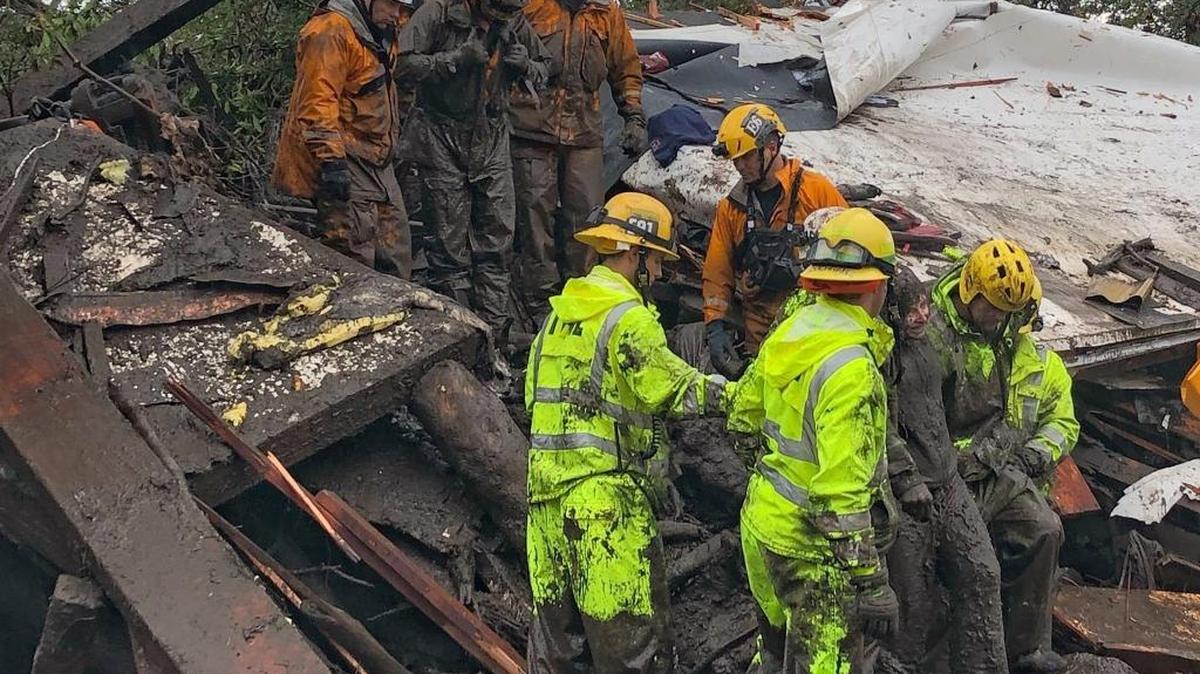 In a Santa Barbara County Fire Department photo, emergency workers rescue a 14-year-old girl, right, after she was trapped inside a home destroyed by a mudslide in Montecito, Calif., Jan. 9, 2018. Drenching rain sent mud roaring down the hillsides of Santa Barbara County on Tuesday, killing at least five people, carrying houses off their foundations, snapping telephone poles and wrapping vehicles around trees, the authorities said.