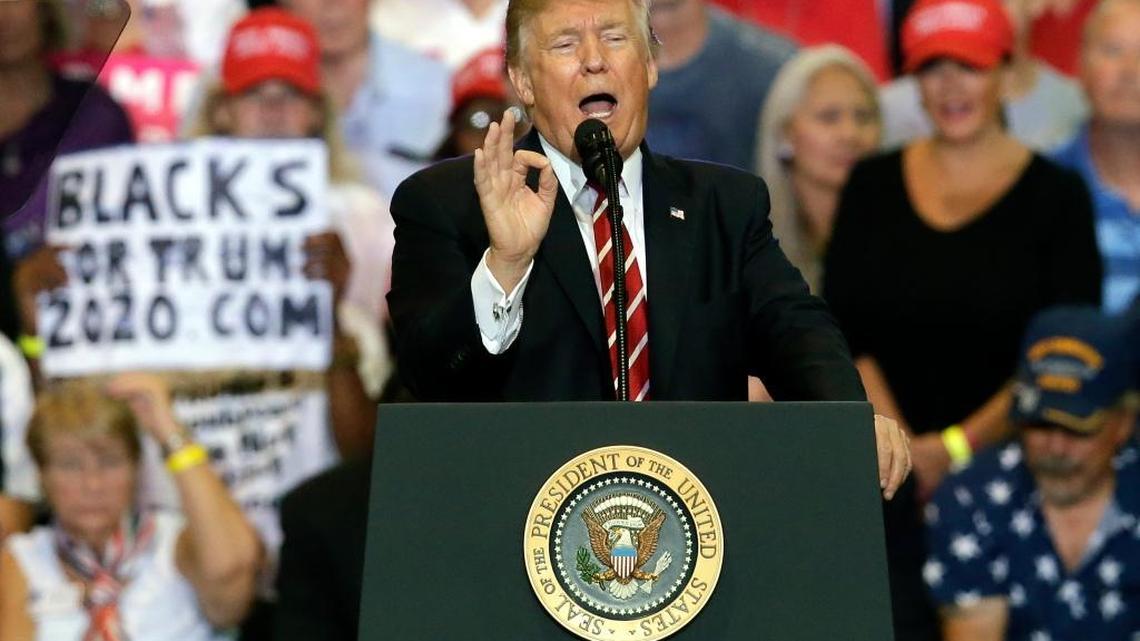 President Donald Trump plays to his base in August at a post-Charlottesville rally in Phoenix, calling the news media “sick,” deriding Arizona’s Republican senators as “weak” and hinting at his eventual pardon of ex-Sheriff Joe Arpaio, who had been convicted of criminal contempt for disobeying a court order to stop profiling Latinos. (AP Photo/Rick Scuteri)