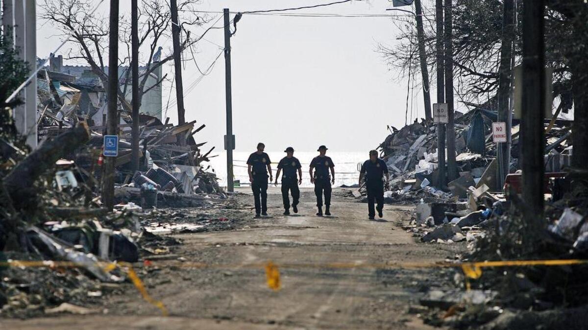
Officers from the Florida Highway Patrol inspect the damage left by Hurricane Katrina in Bay St. Louis, Miss., in September 2005 – weeks after the storm had blown through.
