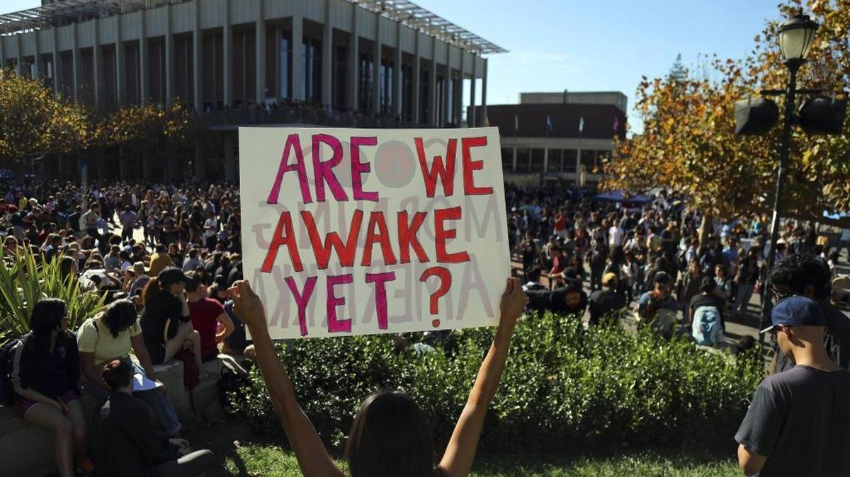 High school and college students protest the election of Donald Trump at UC Berkeley, Nov. 9, 2016. Despite improved turnout in the presidential election, only 53 percent of California millennials are registered to vote. (Jim Wilson/The New York Times)