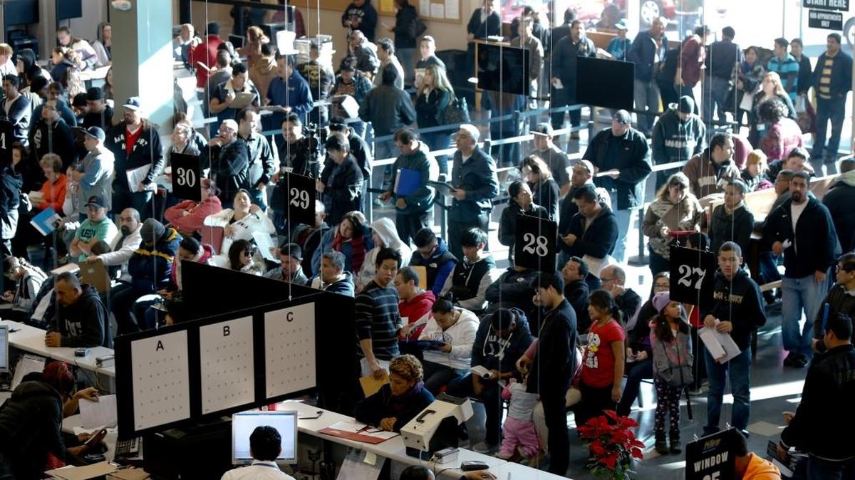 Hundreds of people without legal status line up inside the Department of Motor Vehicles office in Stanton, Calif., for an opportunity to get their driver's licenses on Jan. 2, 2015.