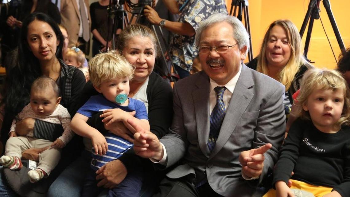 San Francisco Mayor Ed Lee with parents and children in 2016 after signing a parental leave ordinance for the city. San Francisco is the first U.S. city to require employers to offer parents fully paid maternity and paternity leave.