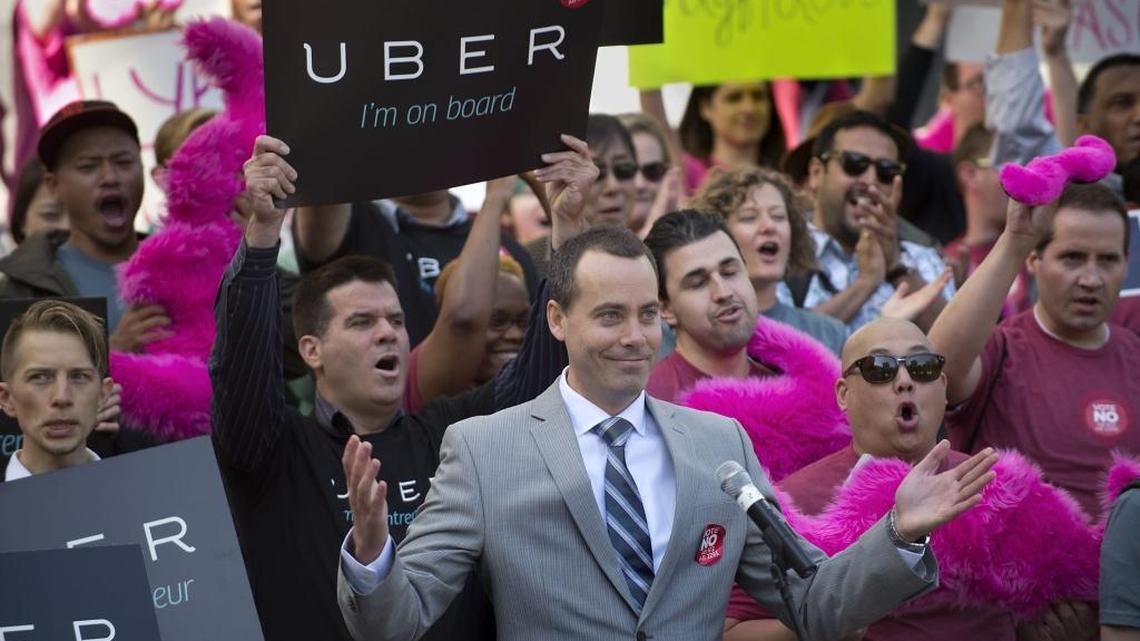 Uber and Lyft drivers rally at the Capitol in 2014. Laws that allow debt collectors to empty the bank accounts of low income debtors are especially punishing on those who earn intermittently and live off of their savings, such as seasonal workers and members of the gig economy.