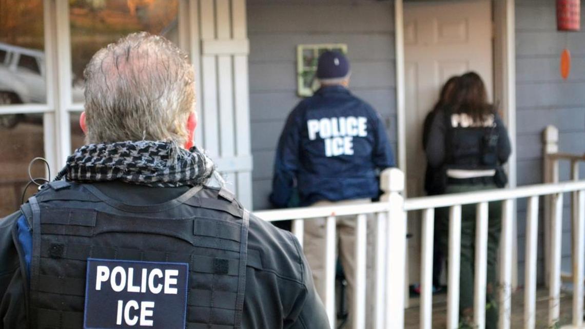 U.S. Immigration and Customs Enforcement (ICE) agents seek immigration fugitives at a home in Atlanta in February.