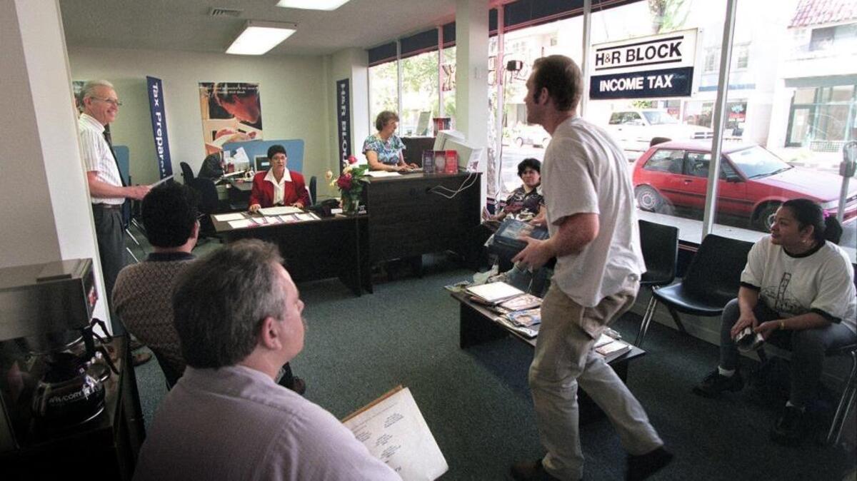 Tax preparers work on deadline at a Sacramento H&R Block office. A proposed tax reform would impose a sales tax on accounting, advertising and other services.
