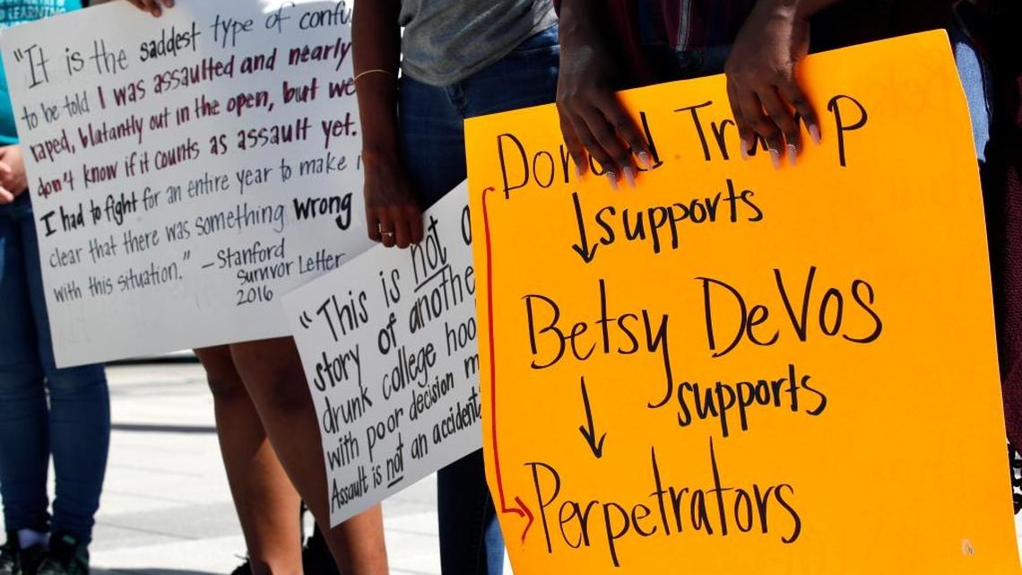Protesters rally against proposed changes to Title IX before a speech by Education Secretary Betsy DeVos, Thursday, Sept. 7, 2017, at George Mason University’s Arlington, Va., campus. DeVos plans to end the Obama administration’s rules for investigating allegations of sexual violence on campus. (AP Photo/Jacquelyn Martin)