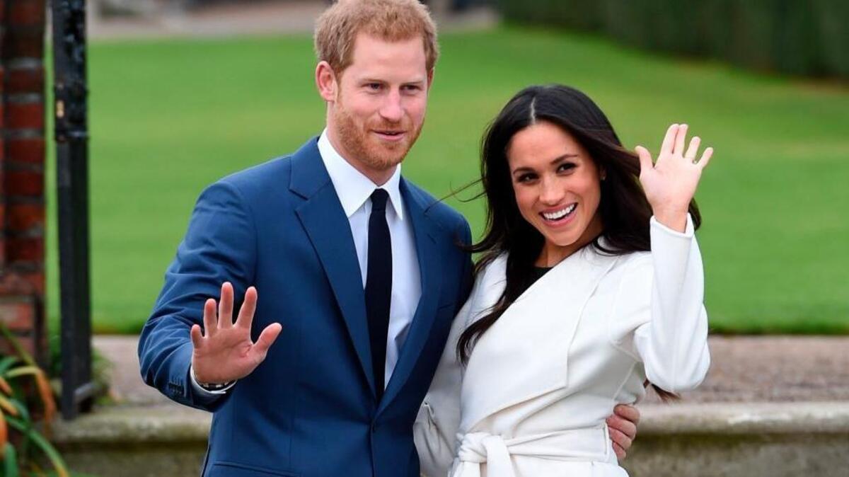 Britain’s Prince Harry, left, and Meghan Markle pose at Kensington Palace in London in 2017. They will wed on Saturday, May 19. (Eddie Mulholland/Pool via AP)